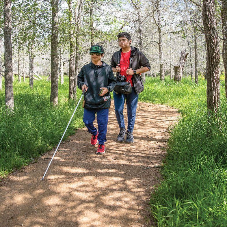 Blind hikers explore a trail