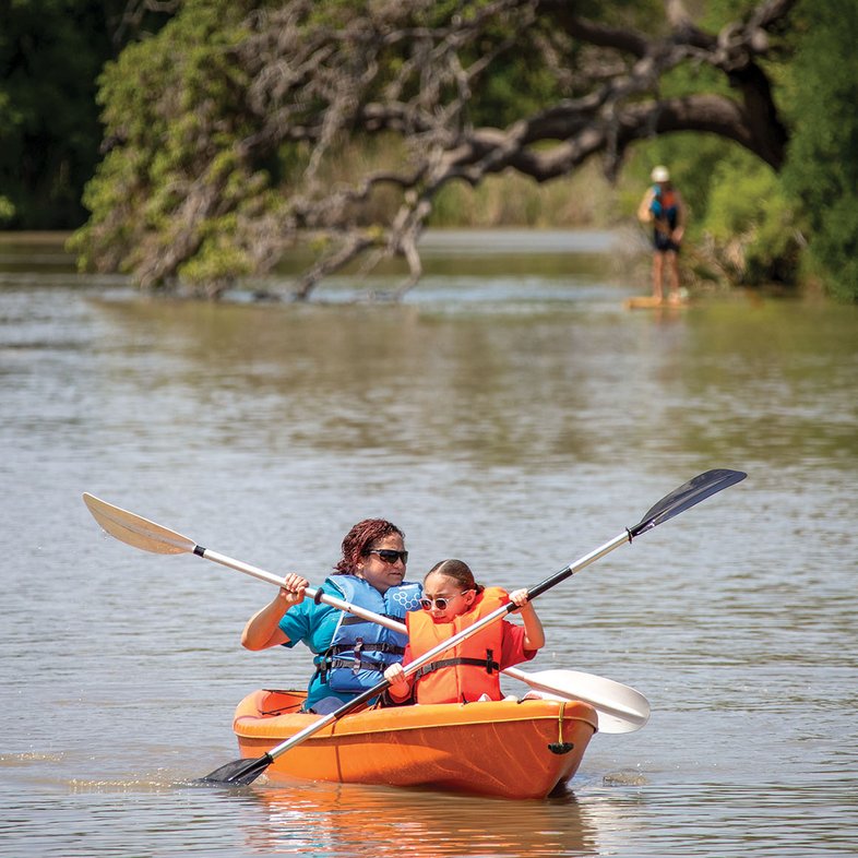 Participants in the BOLD program paddle a kayak