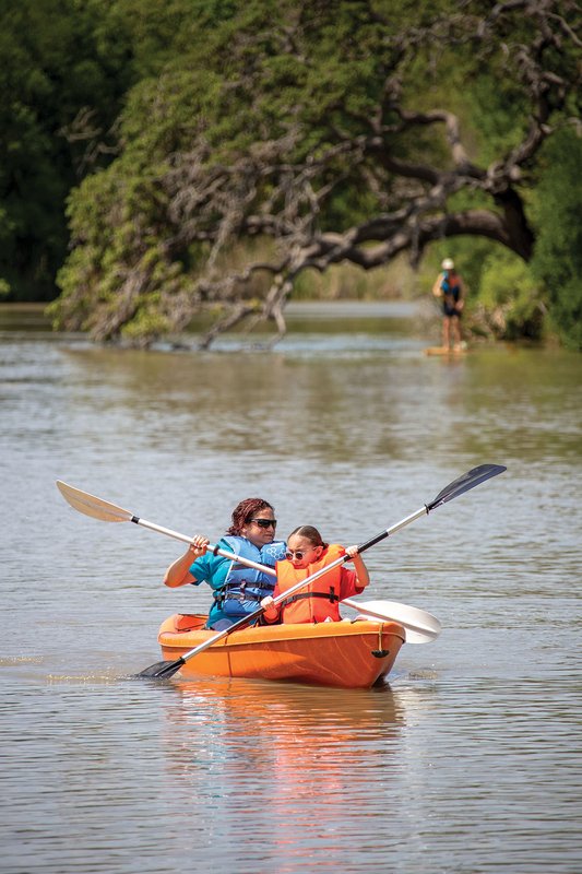 Participants in the BOLD program paddle a kayak