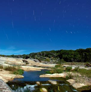 Pedernales Falls at night with stars