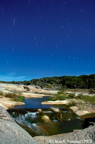 Pedernales Falls at night with stars