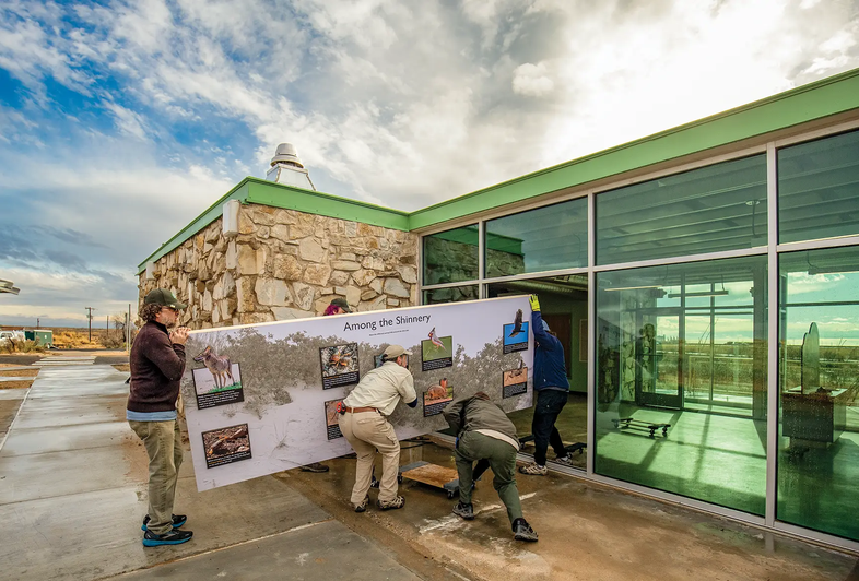 People caring sign into Monahans Exhibits