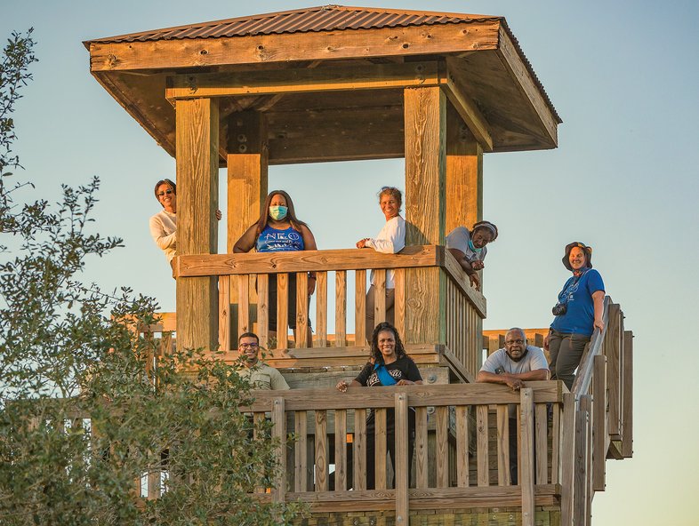 People posing on an obersvation tower at Brozos Bend State Park