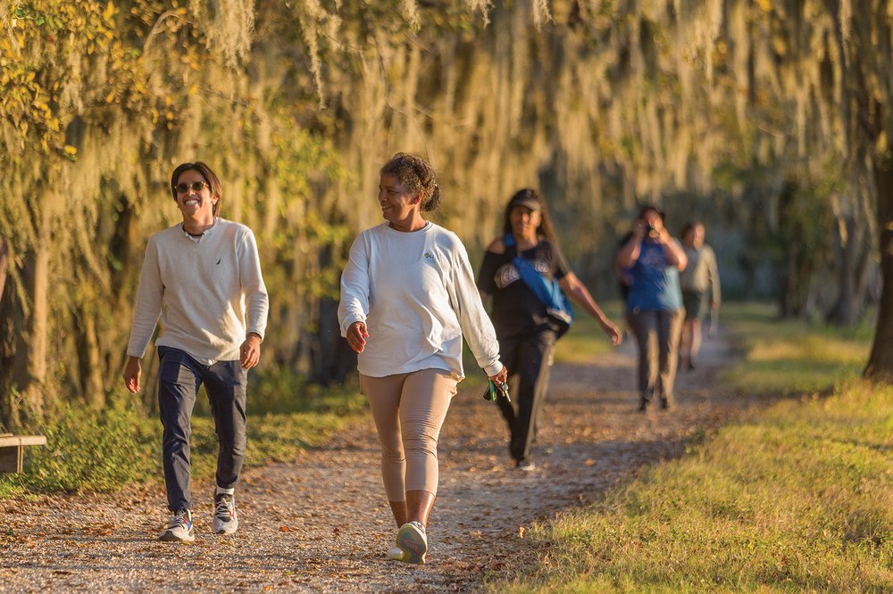 People walking a trail at Brazos Bend