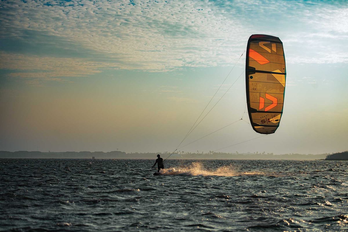 Person in the water kiteboarding.