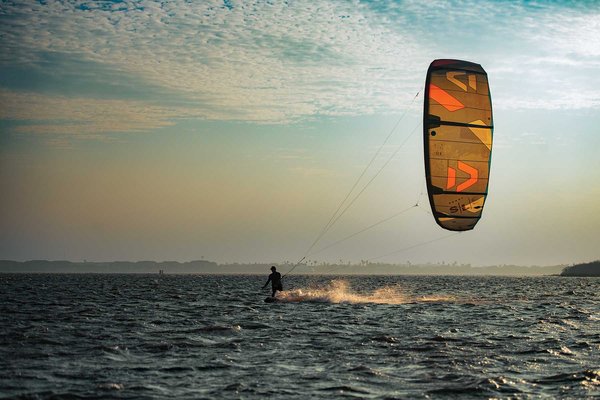 Person in the water kiteboarding.