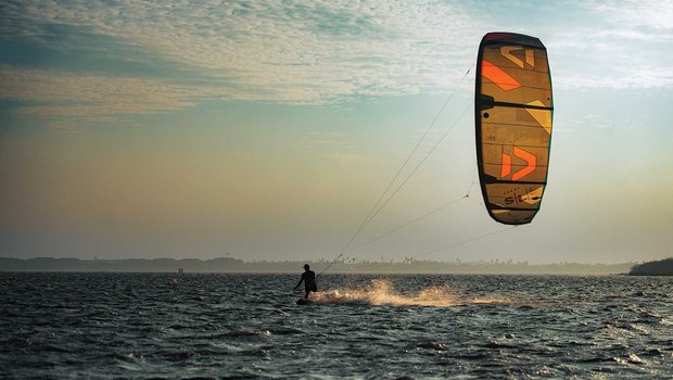 Person in the water kiteboarding.