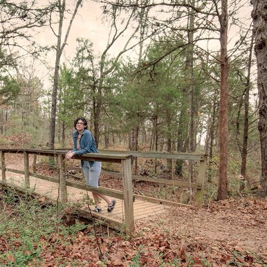 Person on a bridge on the Beaver Slide Nature Path