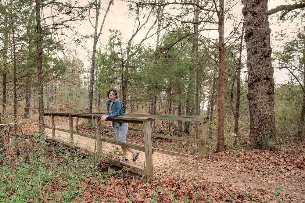 Person on a bridge on the Beaver Slide Nature Path