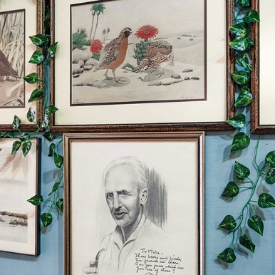 Portrait of Rex Brasher with his bird artwork.