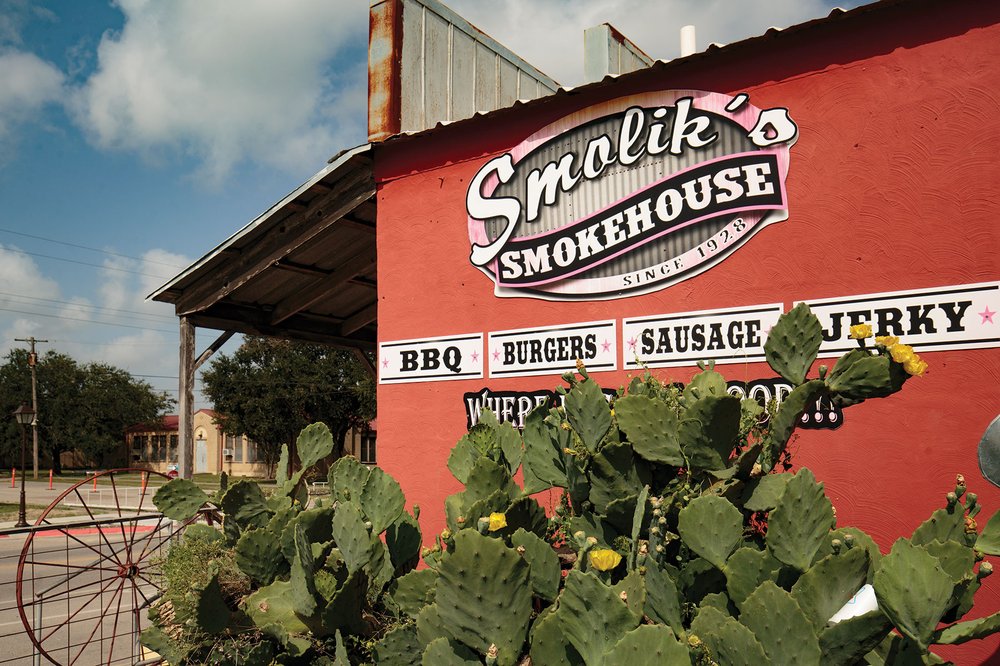 Red building with a Smolik's Smokehouse sign