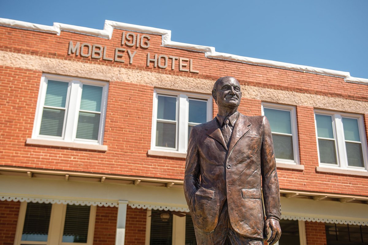 Statue of Conrad Hilton in front of the Mobley Hotel in Cisco Texas.