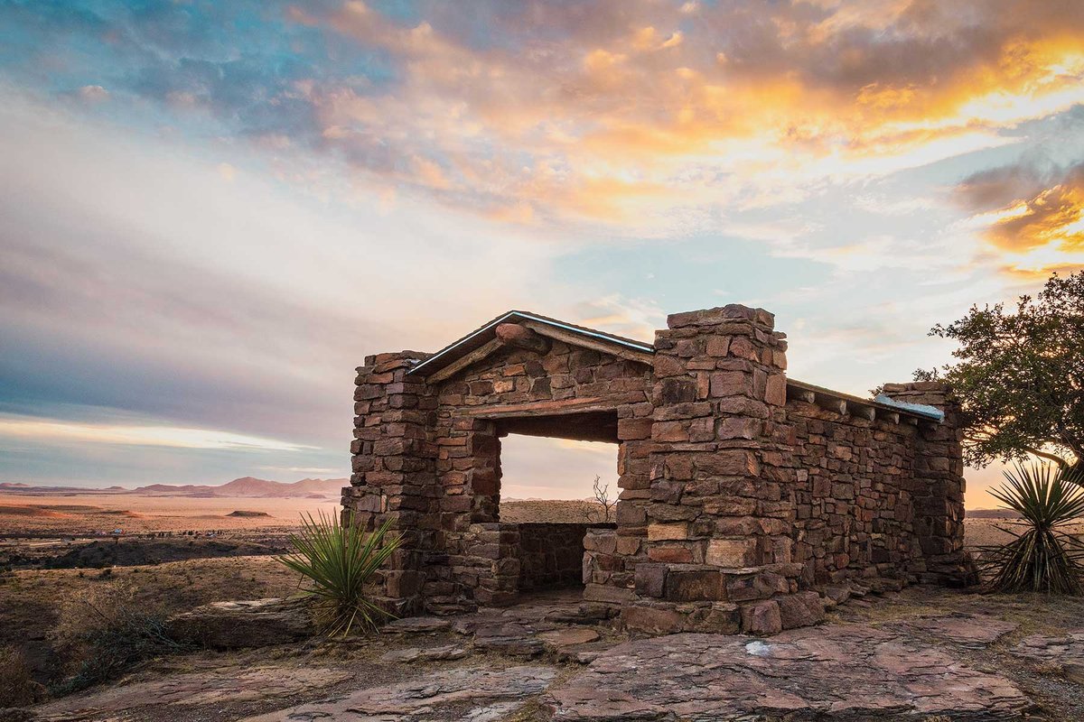 Stone structure in Davis Mountain State Park at sunset.