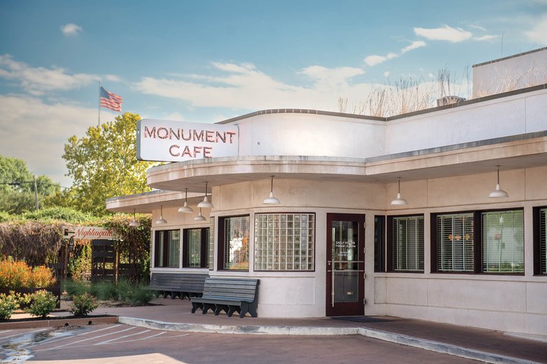 The Monument Cafe sign and Building.