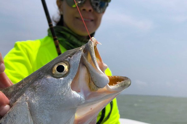 Woman fishing for speckled seatrout