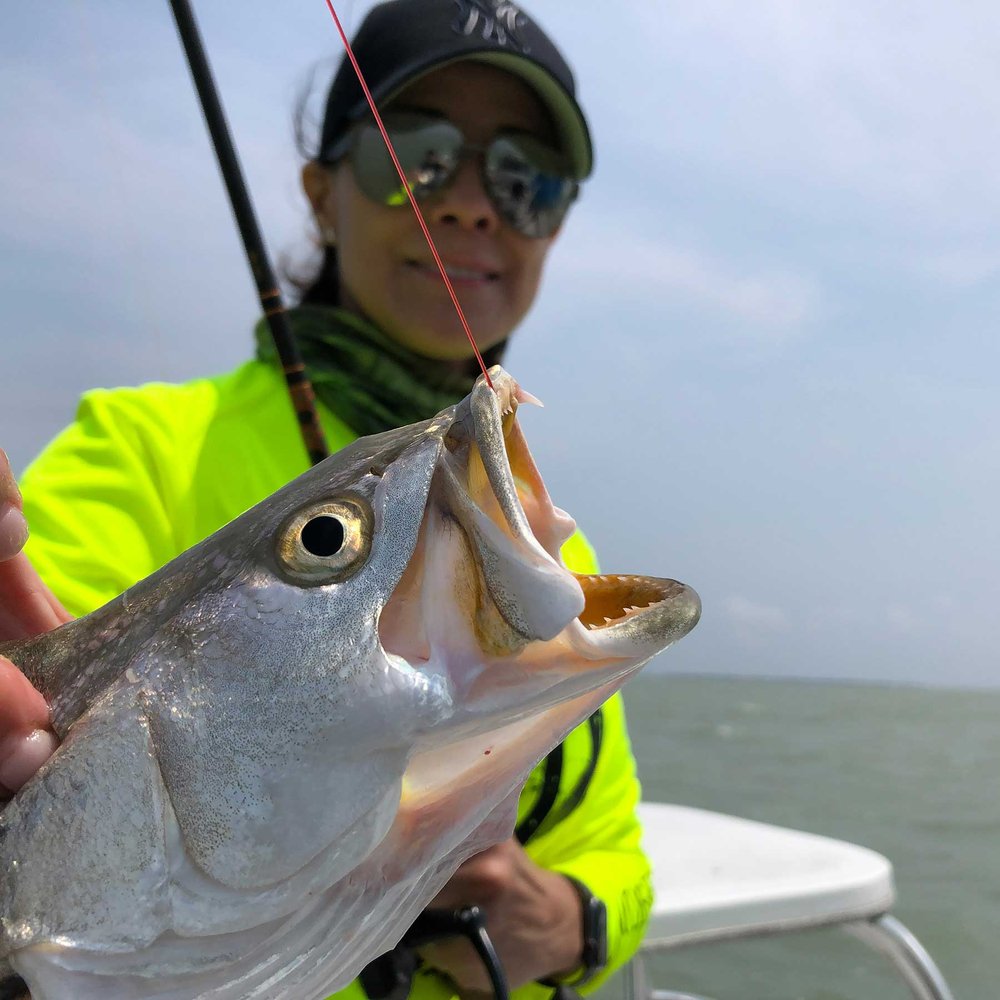 Woman fishing for speckled seatrout