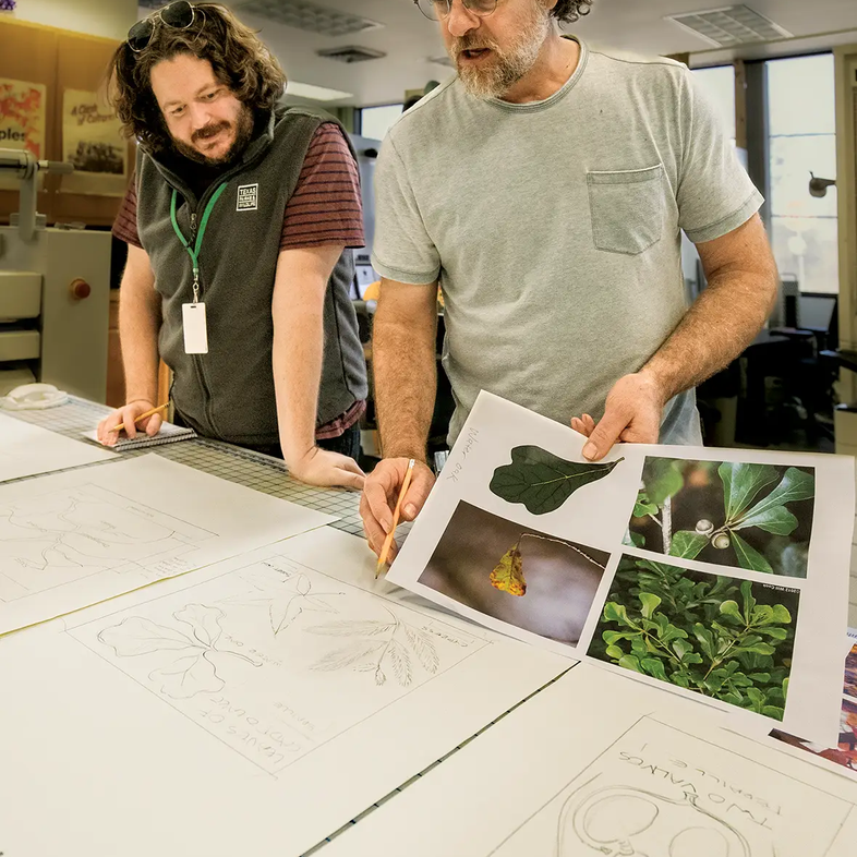 Two State Park Team members creating sketches for replicas to place in exhibits