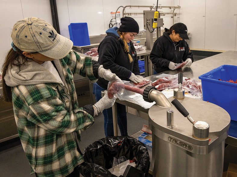 Volunteers processing deer meat for Hunters for the Hungry.