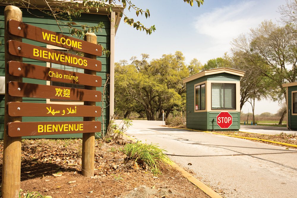 Welcome sign in various languages at Brozos Bend.
