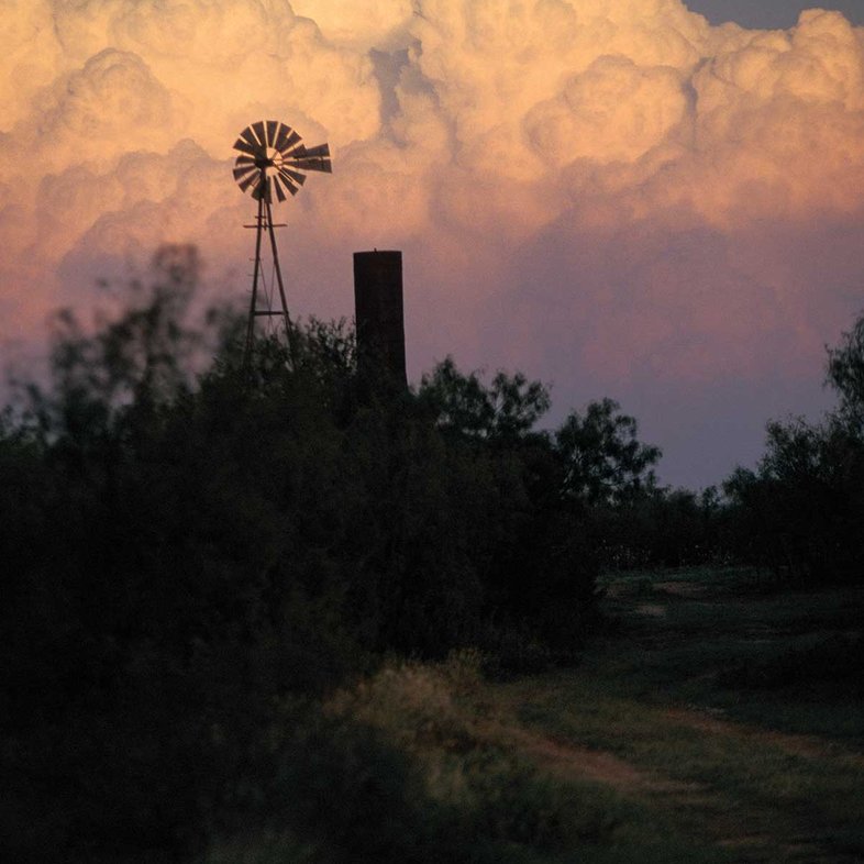 Windmill against a cloudy sky.
