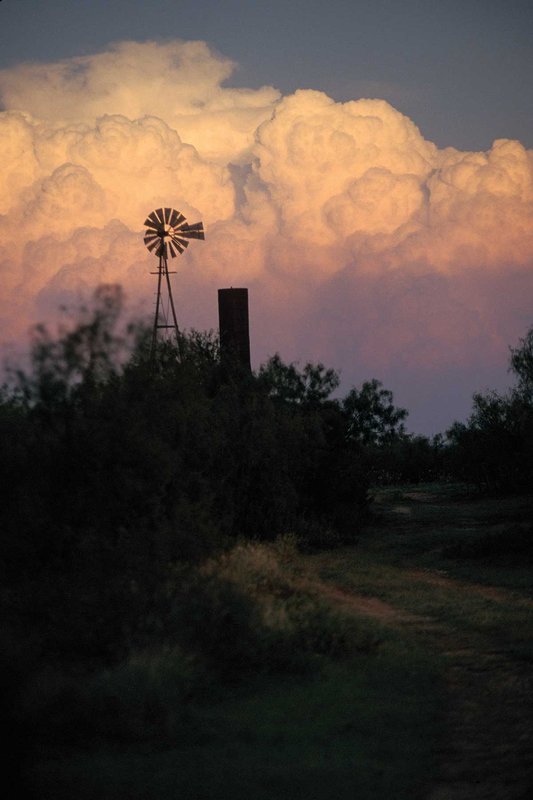 Windmill against a cloudy sky.