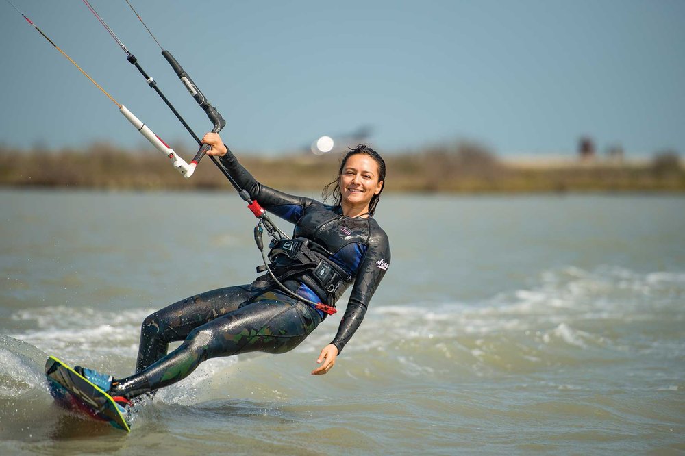 Woman kiteboarding.