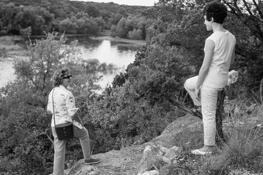 Women at Meridian State Park stand on Bee Ledge lookout point facing the park’s 72-acre lake