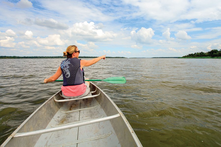 Woman in the front of a canoe with a paddle