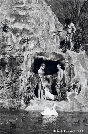 Aquamaids and Polynesian-themed show on a rocky and cavernous hill at Aquarena