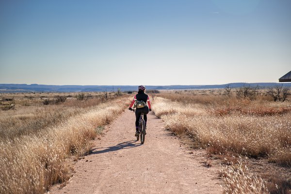 A biker rides on dirt railsway