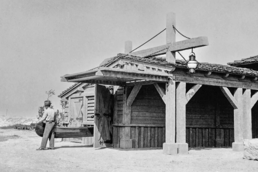 man walking outside of bonham boathouse