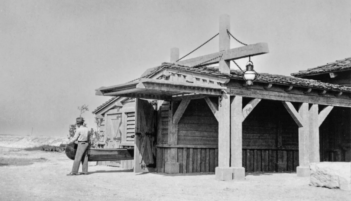 man walking outside of bonham boathouse