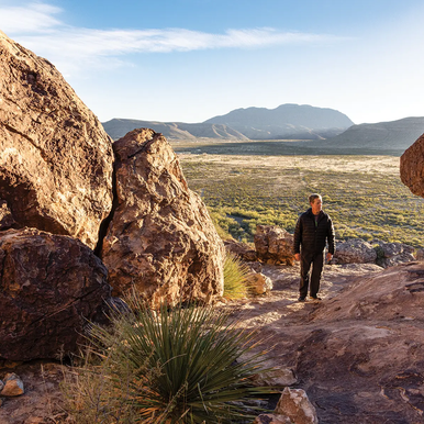 Hueco Tanks person walking between two bolders