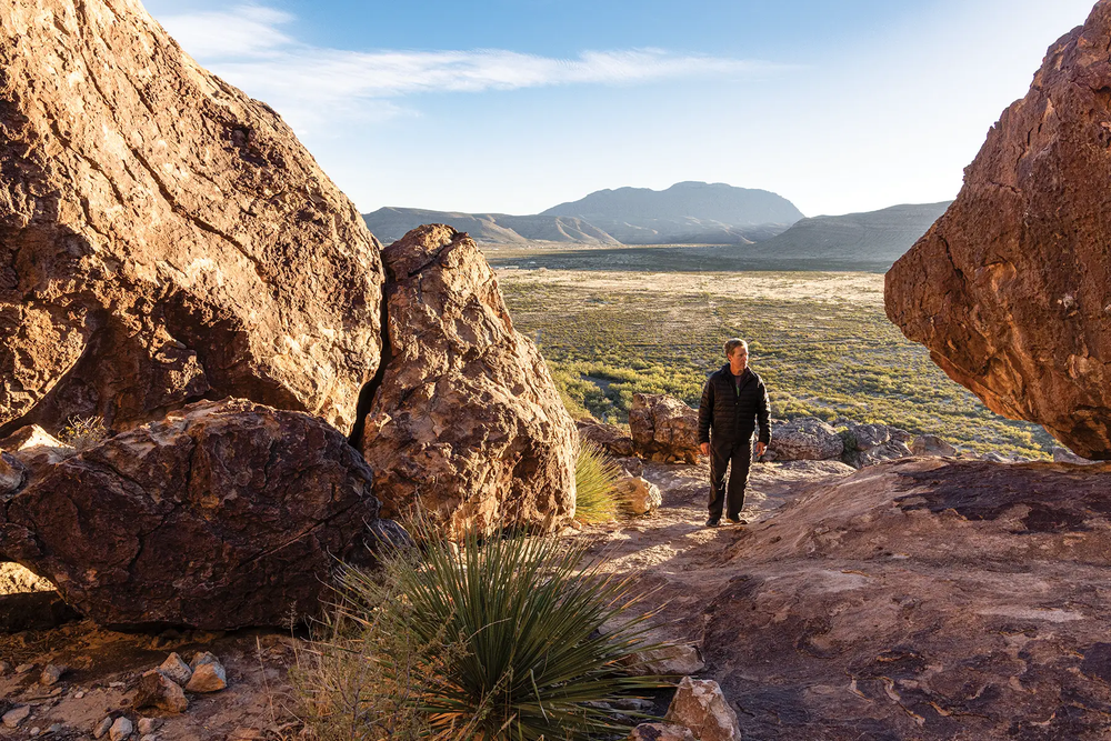 Hueco Tanks person walking between two bolders