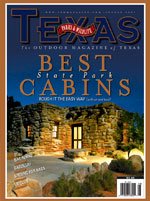 Cover August 2007 picturing a lit up stone cabin at night. The title is Best State Park Cabins