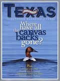 December 2004 Cover - Canvas Back Duck swimming away from shore - Title: Where have all the canvas backs gone?