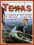 October 2004 Cover - Person repelling down a cliff for rescue practice - Title: Rescue Rehersal