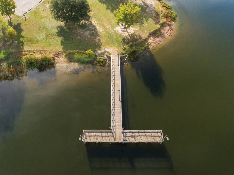 t-shaped fishing pier coming off land and into the water