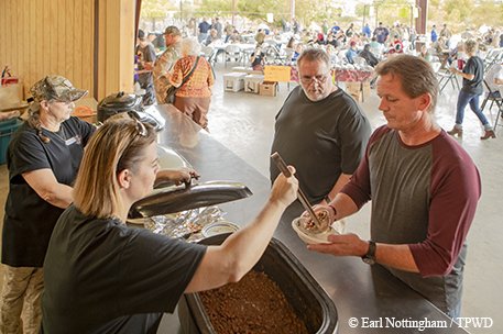 Hunters gather at the community pavilion for a chili lunch.