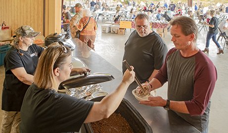 Hunters gather at the community pavilion for a chili lunch.