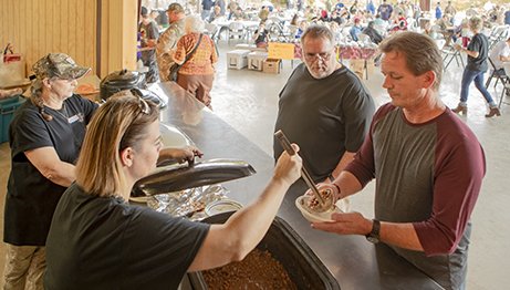 Hunters gather at the community pavilion for a chili lunch.