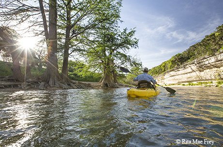 Person paddling the guadalupe river park paddle trail