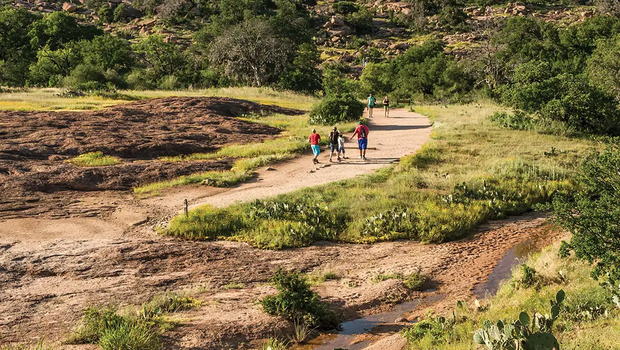 hikers hiking up to enchanted rock