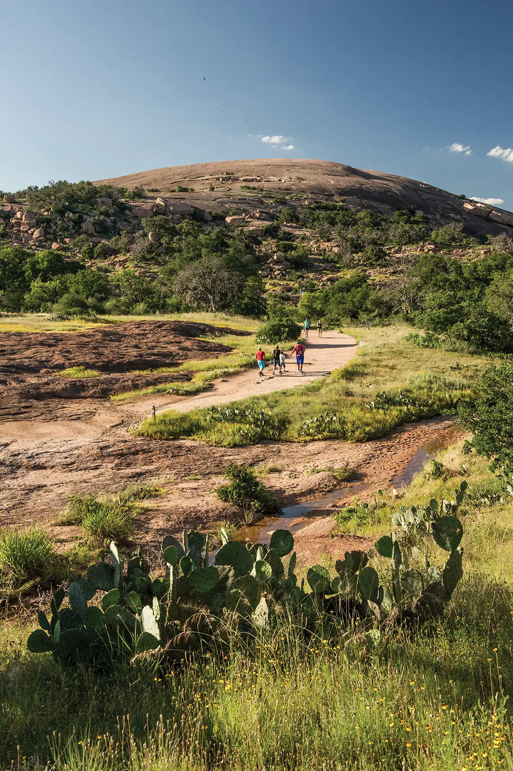 hikers hiking up to enchanted rock