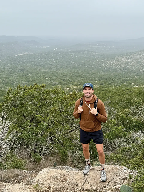 John Sorsby Standing on a rock in the hill country.