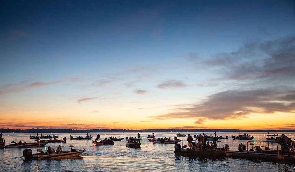 As the sun rises, dozens of fishing boats prepare to launch on Lake Fork in search of largemouth bass