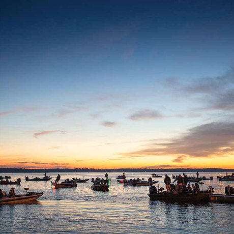 As the sun rises, dozens of fishing boats prepare to launch on Lake Fork in search of largemouth bass