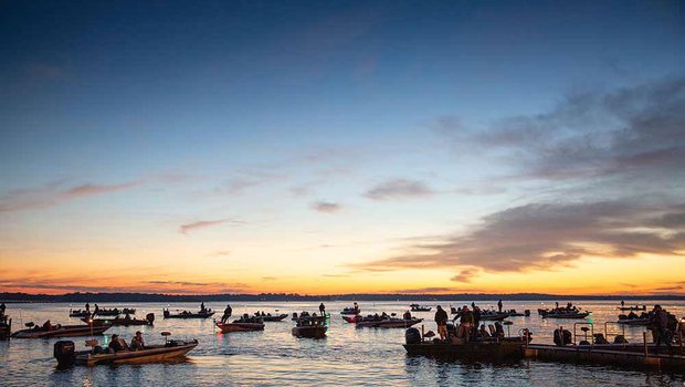 As the sun rises, dozens of fishing boats prepare to launch on Lake Fork in search of largemouth bass