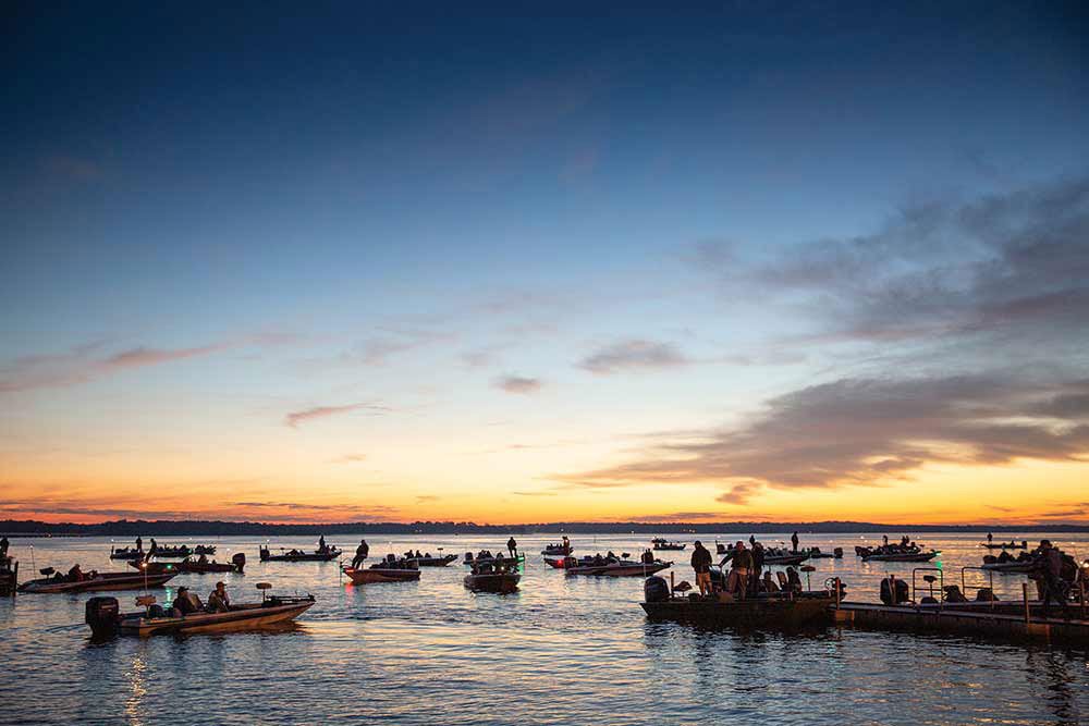As the sun rises, dozens of fishing boats prepare to launch on Lake Fork in search of largemouth bass