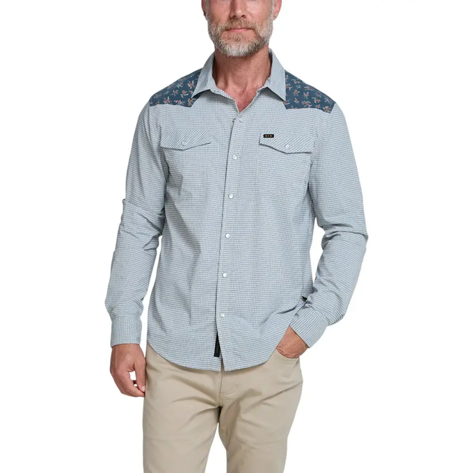 A man wearing a Nomadix shirt.